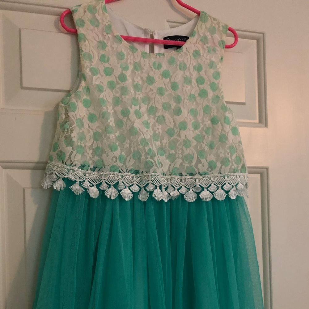 This is a girls dress size 10, only been worn a couple times and no stains.